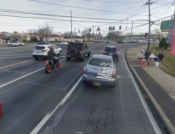 A white sedan traveling eastbound on Main Street turned right onto southbound Route 110 and struck a man in Farmingdale.