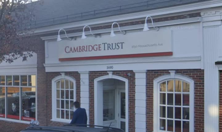 A former customer service employee at a Cambridge Trust bank branch used a $65,000 treasurer&#x27;s check to buy a BMW SUV, prosecutors said.