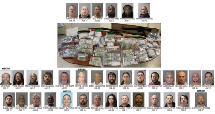 The arrested and some of the drugs seized.
