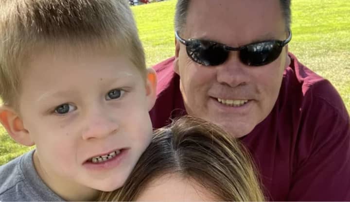 Fallen Patrol Officer Timothy Stewart of the Putnam County Sheriff&#x27;s Office pictured with his son, Aiden, and wife, Toni.