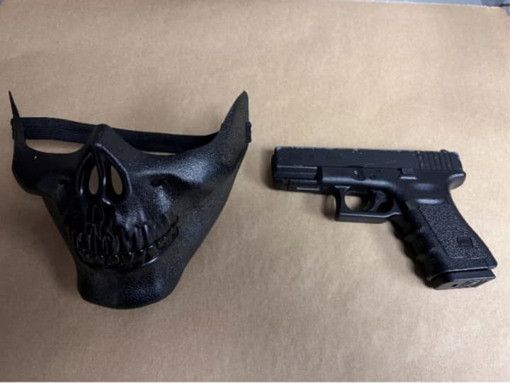 Police discovered a black skeleton mask and a fake Glock handgun in the suspect&#x27;s possession.