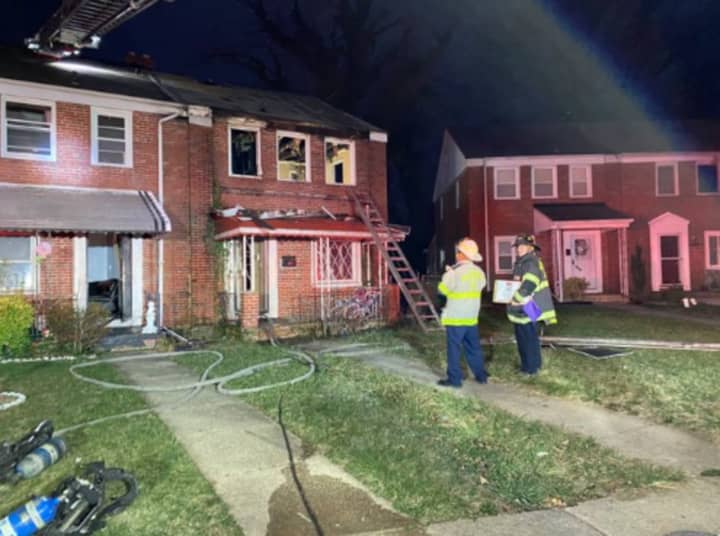 One person was found dead inside an engulfed home in Baltimore.