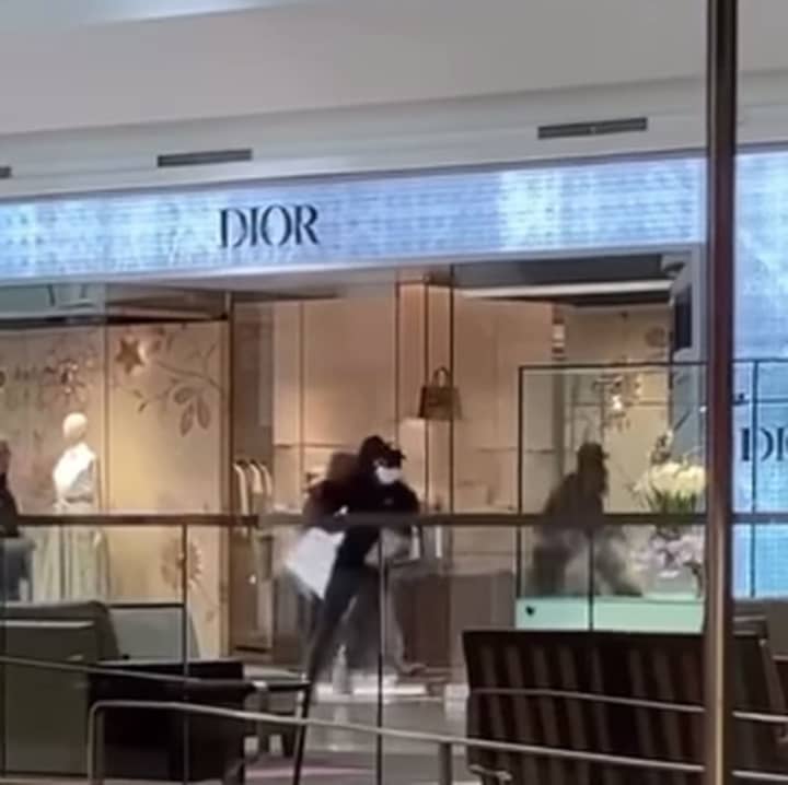 Video captures the masked men making off with $125,000 in purses from Dior at the Short Hills Mall.