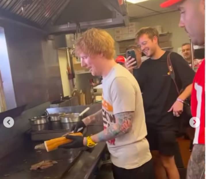 Ed Sheeran in the kitchen of Philip&#x27;s Steaks.