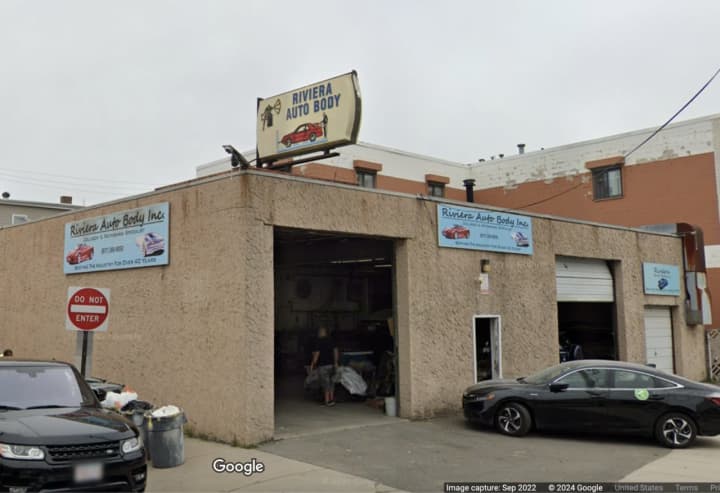 Riviera Auto Body, located in Everett, was at the center of the scheme, officials said.