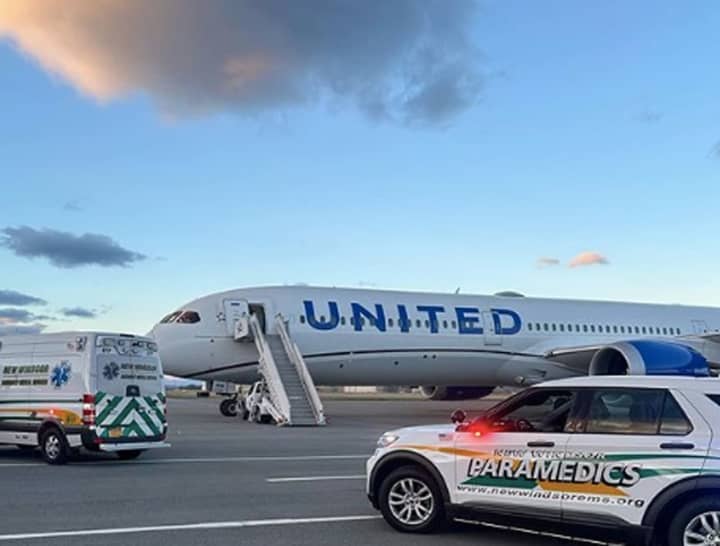 A flight bound for Newark Liberty International Airport was diverted to Orange County, NY, officials said citing both turbulence and an ailing passenger.