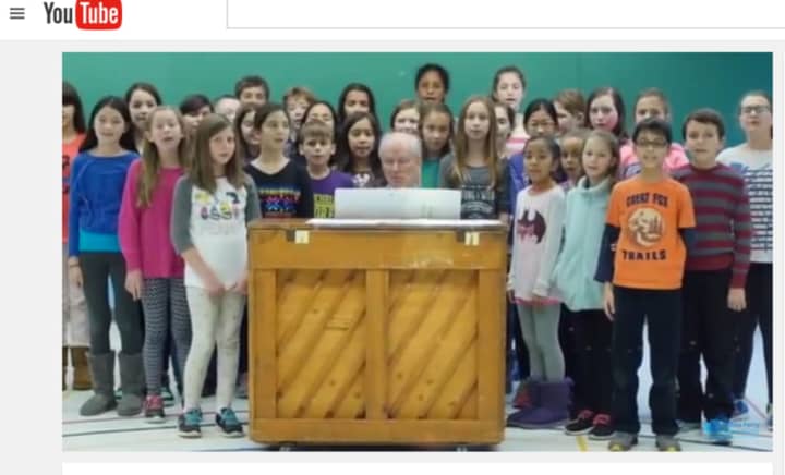 Fifth graders at Dobbs Ferry Springhurst Elementary School sing for those who died in terrorists attacks in Paris, France and San Bernardino, Calif.