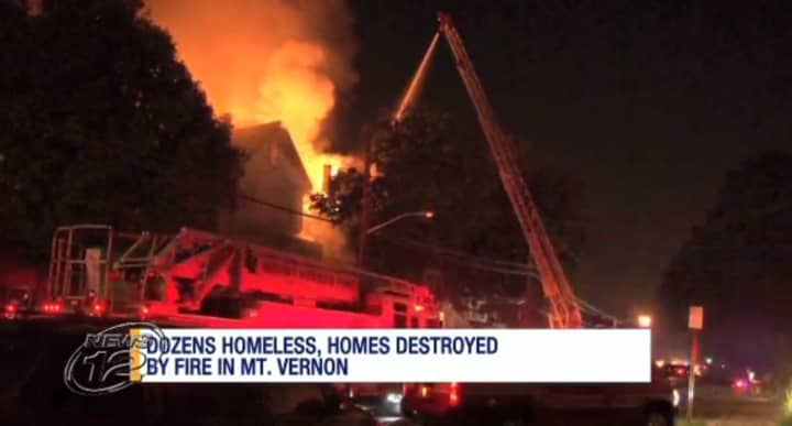 A fire tore through two homes and damaged a third in Mount Vernon on Saturday night. Arson is suspected.