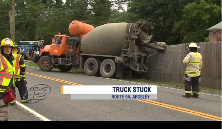 A truck needed to be towed out of deep mud Monday along the side of Route 9A in Ardsley.