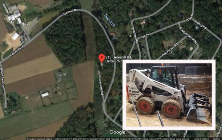 A skid loader and a map of the area where the man was found.