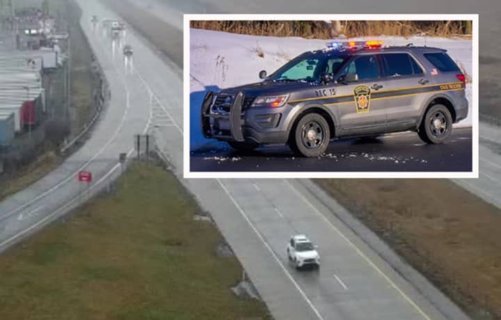 A Pennsylvania state police vehicle and Exit 24 of Interstate 81 just before the area where the rollover crash happened.