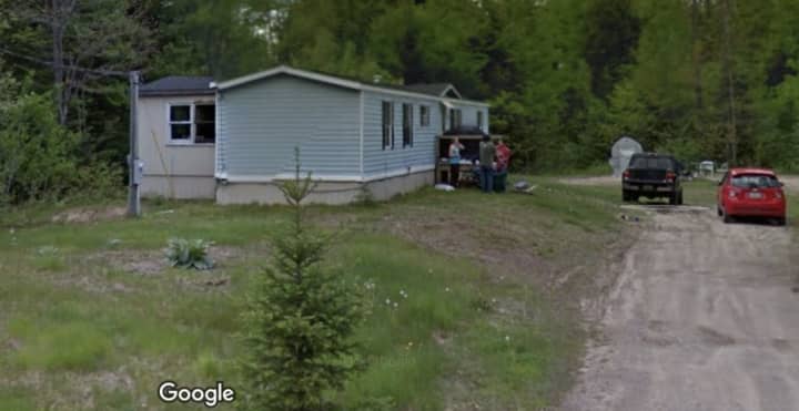 Deputies found the body of Shoeb Mohamed Adan, of Springfield, and a 16-year-old boy from Lewiston, Maine, inside this home at 205 Tripp Lake Road in Poland, Maine, last week. Investigators arrested a 46-year-old and charged him with the killings.