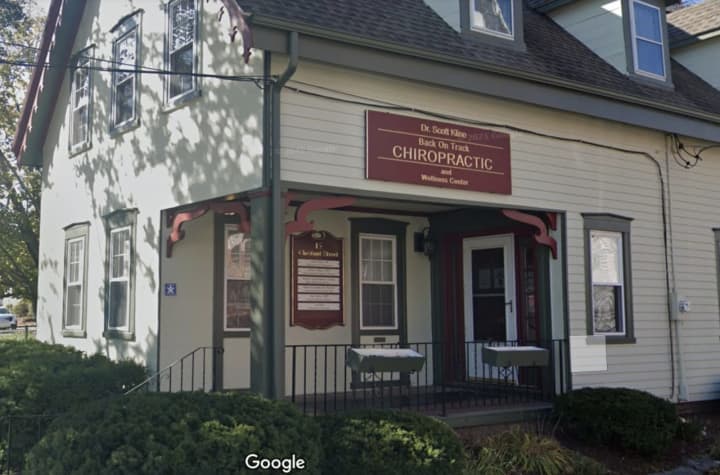 Scott Kline, a Peabody chiropractor, is charged with spying on patients at his 20 Church Street practice with a hidden camera in the bathroom, police said.