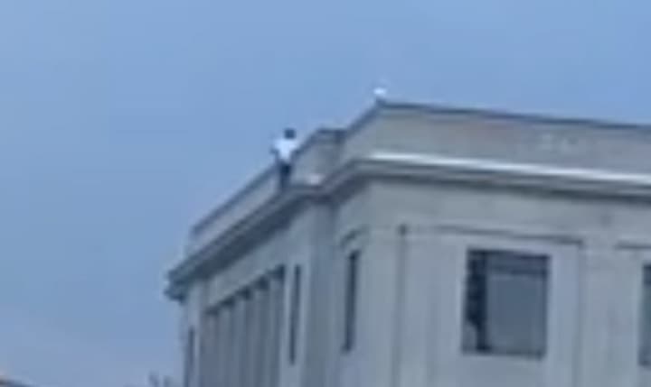 A man was climbed to the top of Linden&#x27;s city hall Monday and threatened to jump