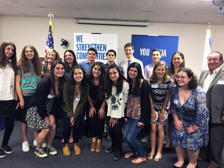 These teens received Singer Scholarship Awards for summer programs in Israel from Saul Singer, far right, and Fran Singer, top row, third from left.