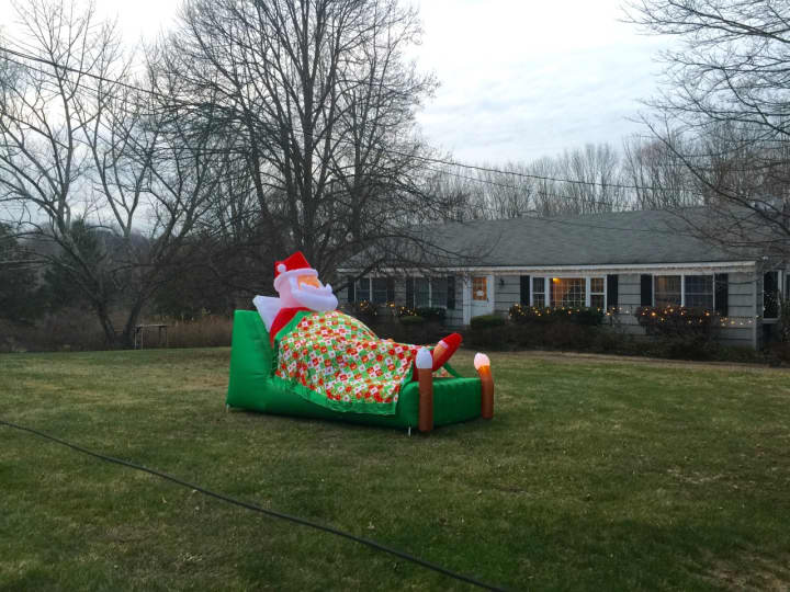 Santa is catching a few winks -- and sparking smiles -- before his big delivery day. You can catch the holiday bug by enjoying the Christmas display on Bouton Road in South Salem.