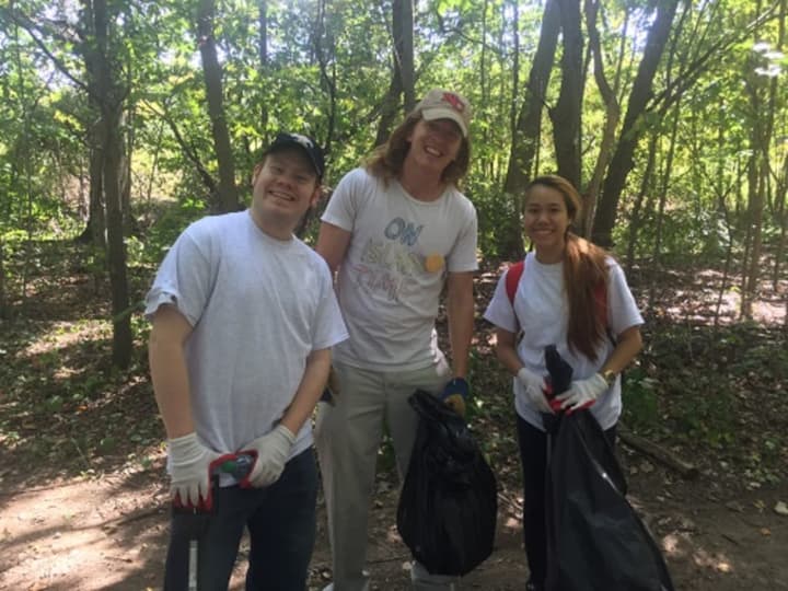 Volunteers helped clean up the area of a pond, part of the Five Mile River watershed, Saturday on Norwalk Community College&#x27;s West Campus. From left are: Nate Seper, Rob Knechtle and Sally Srikaew.
