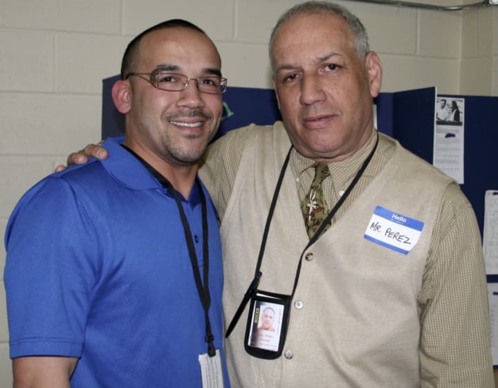 Sprain Brook Academy graduate Michael Lopez and English teacher Joe Perez.