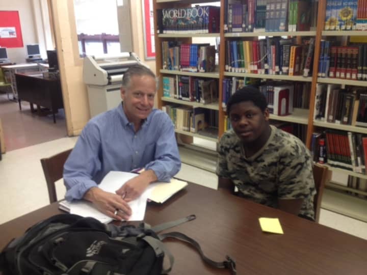 Stuart Silverman tutors Timothy Shubrick as part of the Yonkers Partners in Education program.