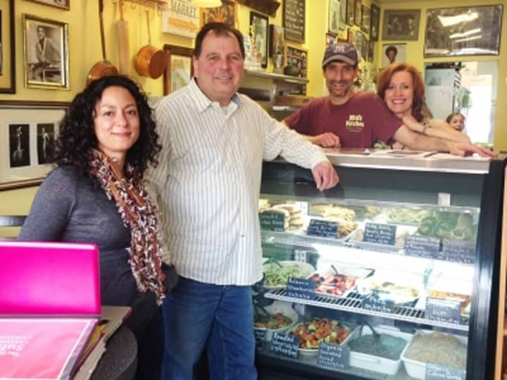 Alex Evans, left, who guides the Suffern Chamber of Commerce&#x27;s social media campaign, stands with Chamber president Aury Licata, center, and Cynthia Gray and Michael Narciso, owners of Mia&#x27;s Kitchen, a village restaurant.