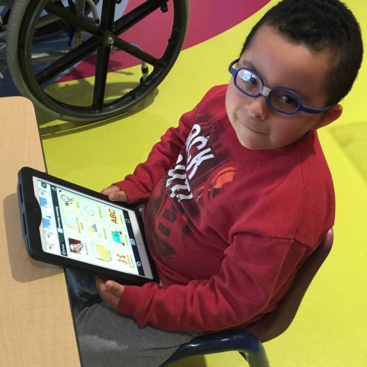 Antonio uses an app on his tablet to communicate at the Sunshine Children’s Home Home &amp; Rehabilitation Center.