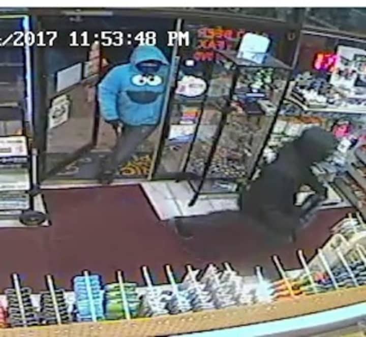 Two suspects enter the Rainbow News and Variety in Norwalk Saturday night.
