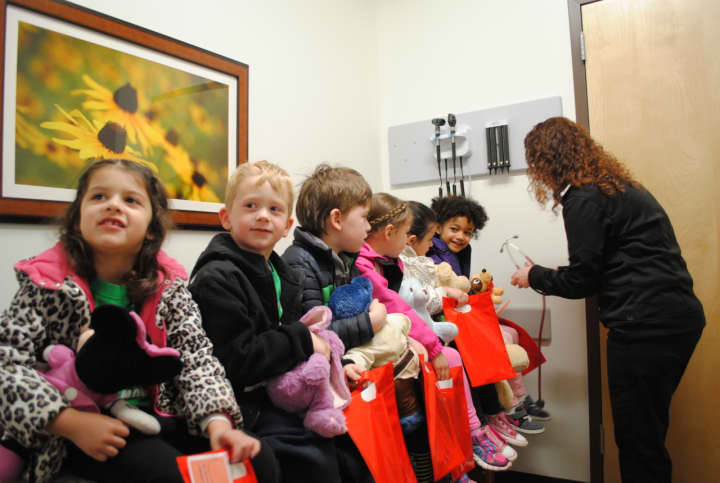 Children from the Pied Piper preschool recently took their teddy bears to the AFC Urgent Care to receive treatment during the Ted E. Bear Fair.