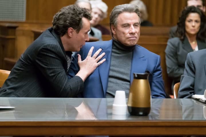 Chris Kerson, a native of Larchmont, left, playing Willie Boy Johnson in a courtroom scene with John Travolta in the new movie, &quot;Gotti.&quot;