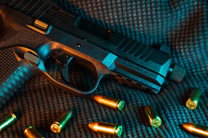 A handgun and bullets.