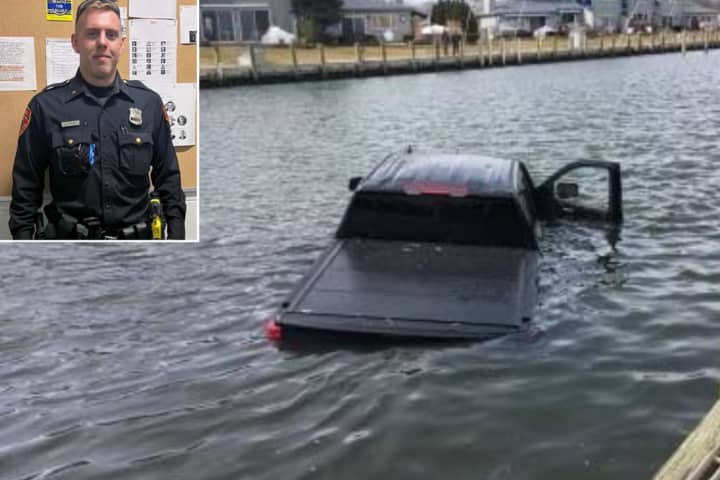 Suffolk County Police Officer Daniel Elitharp rescued a pickup truck driver after the man drove into Patchogue Bay near Sunset Lane and River Avenue on Monday afternoon, March 6.