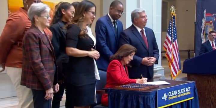 Gov. Kathy Hochul signs the “Clean Slate Act” into law during a ceremony in Brooklyn Thursday, Nov. 16.
  
