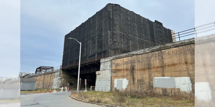 Albany's Central Warehouse building covered in black safety netting in January 2024.&nbsp;