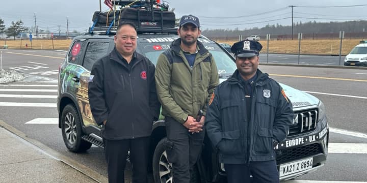 Sinan Mohammad with members of the Suffolk County Police Department on Wednesday, Feb. 28.&nbsp;
