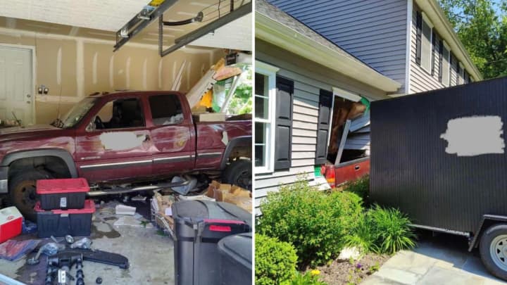A truck and trailer crashed into a garage at a residence on Mahopac Avenue in Somers.