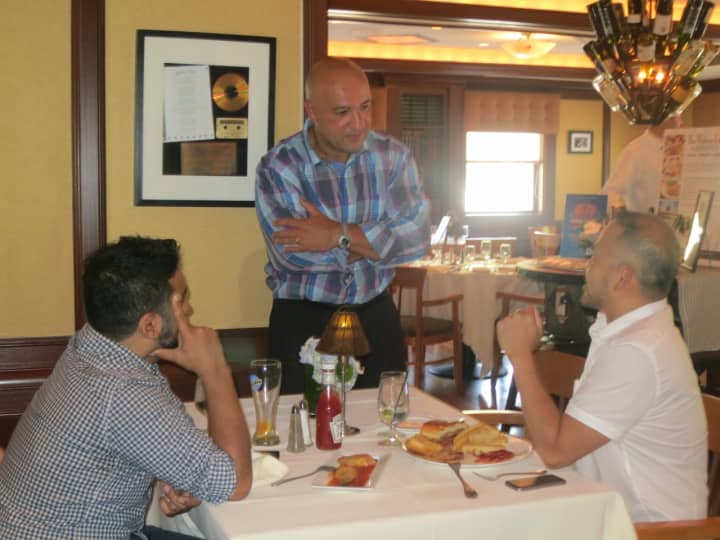 Sal Latorraca, who owns Water&#x27;s Edge at Giovanni&#x27;s with his wife, JoAnn, talks with diners at the event. 
