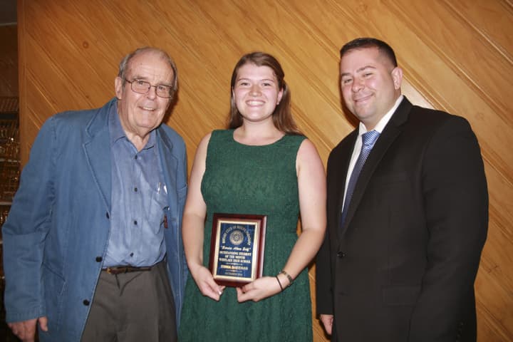 Rotarian John Whearty, Emma Sheehan and service club adviser and Westlake guidance counselor Nick DiPaolo.