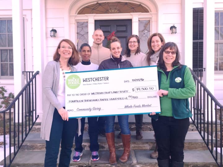 Westchester Land Trust members accept a donation from Whole Foods Market.