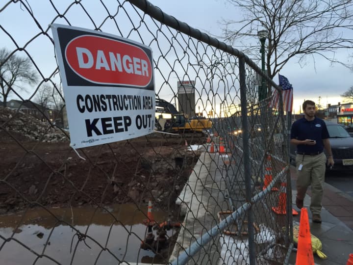 A sign warns bystanders to keep out while site preparation proceeds in Teaneck.