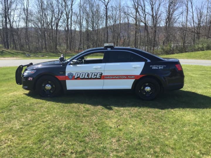 A 49-year-old Washington Township man remains in custody after he fired a shotgun at officers who were conducting a welfare check, authorities said.