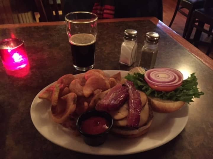 The smoked gouda and slab bacon burger at Watson&#x27;s comes with a heap of Sidewinder fries.