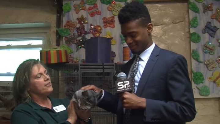 Cindy Polera, head naturalist at the Weinberg Nature Center, shows &quot;Senior Options&quot; host Anito Akuetey a chinchilla, one of the many exotic animals housed at the center.