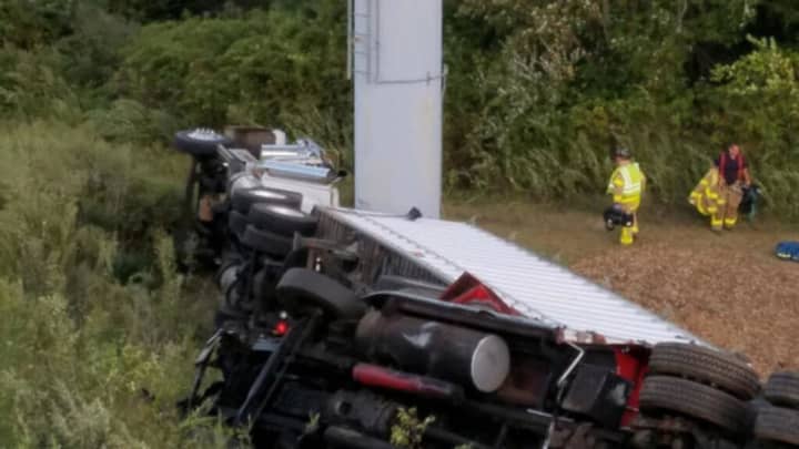 Two tractor-trailer trucks went down an embankment on I-95 on Friday morning, shutting down the right and center lanes between Exits 42 and 41 in West Haven.