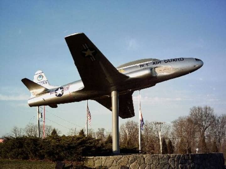 The New York Air National Guard Lockheed T-33B Shooting Star trainer is on display at one of the entrances to the Westchester County Airport.