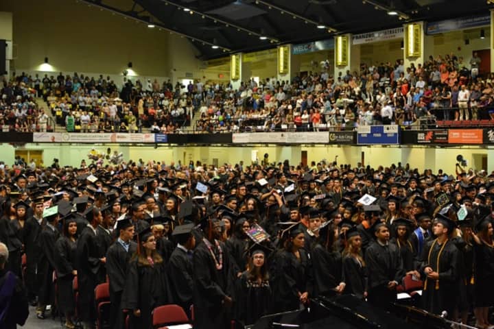 Hundreds of White Plains High School students create a sea of black caps and gowns during commencement exercises at the County Center Saturday.