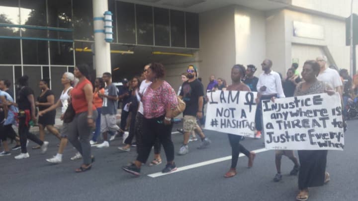 Hundreds march in White Plains on Thursday seeking reforms after the recent killings of two black men by police. They also mourned the loss of the Dallas officers who were gunned down at a rally last week.