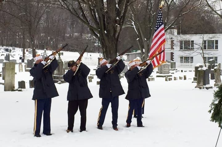 Wyckoff-Midland Park VFW members fire rifles at the December ceremony.
