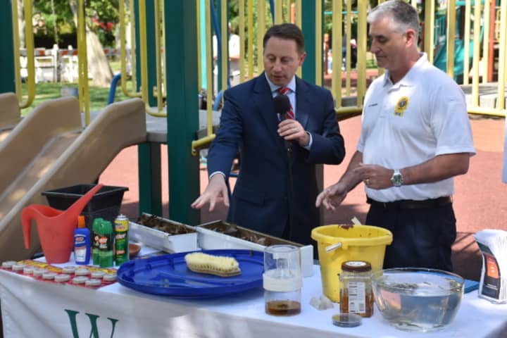 Westchester County Executive Rob Astorino and Peter DeLucia, assistant commissioner for environmental health, discuss ways to reduce mosquito populations.