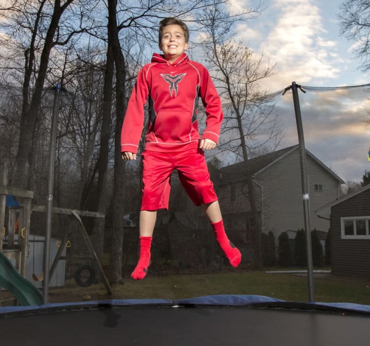 Jimmy Miele is able to jump on his trampoline and play sports after being treated by Dr. James Charles, a headache specialist and neurologist at Holy Name Medical Center, for an unrelenting migraine that lasted for weeks.