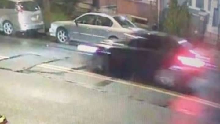Suspect vehicle (in motion, at right)