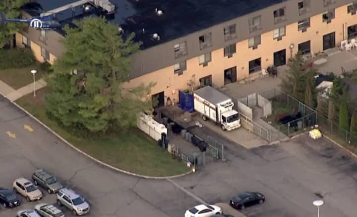 Thirteen bodies reportedly were placed in a refrigerated truck at nearby Newton Medical Center, with four temporarily left in the morgue.